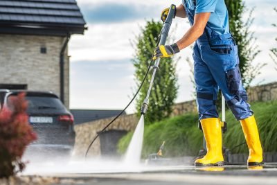 Powerful Pressure Washer Using to Clean Dirty Driveway - Tampa